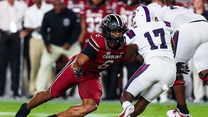 Sep 6, 2025; Columbia, South Carolina, USA; South Carolina Gamecocks linebacker Dylan Stewart (6) brings down South Carolina State Bulldogs running back KZ Adams (17) in the first quarter at Williams-Brice Stadium. Mandatory Credit: Jeff Blake-Imagn Images