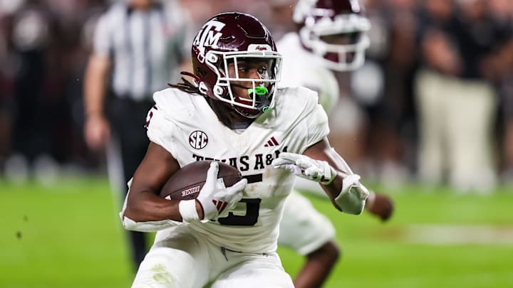 Nov 2, 2024; Columbia, South Carolina, USA; Texas A&M Aggies running back Amari Daniels (5) rushes against the South Carolina Gamecocks in the second quarter at Williams-Brice Stadium. Mandatory Credit: Jeff Blake-Imagn Images Nov 2, 2024; Columbia, South Carolina, USA; Texas A&M Aggies running back Amari Daniels (5) rushes against the South Carolina Gamecocks in the second quarter at Williams-Brice Stadium. Mandatory Credit: Jeff Blake-Imagn Images