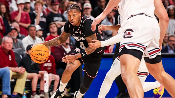 Feb 1, 2025; Columbia, South Carolina, USA; Texas A&M Aggies guard Wade Taylor IV (4) drives against the South Carolina Gamecocks in the second half at Colonial Life Arena. Mandatory Credit: Jeff Blake-Imagn Images Feb 1, 2025; Columbia, South Carolina, USA; Texas A&M Aggies guard Wade Taylor IV (4) drives against the South Carolina Gamecocks in the second half at Colonial Life Arena. Mandatory Credit: Jeff Blake-Imagn Images