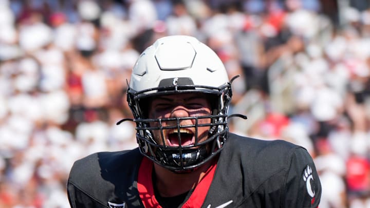 Cincinnati Bearcats offensive lineman Luke Kandra (67) celebrates after Cincinnati Bearcats tight end Payten Singletary (88) scores a touchdown during the first half of the NCAA football game between the Cincinnati Bearcats and the Eastern Kentucky Colonels at Nippert Stadium in Cincinnati on Saturday, Sept. 2, 2023.