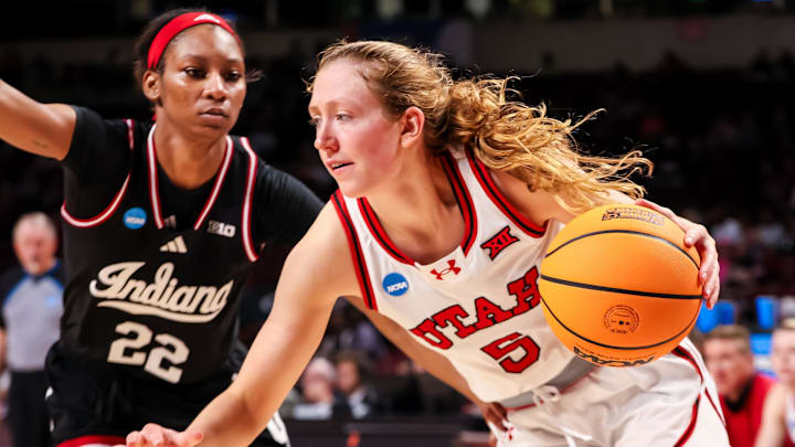 Mar 21, 2025; Columbia, South Carolina, USA; Utah Utes guard Gianna Kneepkens (5) drives past Indiana Hoosiers guard Chloe Moore-McNeil (22) in the second half at Colonial Life Arena. Mandatory Credit: Jeff Blake-Imagn Images Mar 21, 2025; Columbia, South Carolina, USA; Utah Utes guard Gianna Kneepkens (5) drives past Indiana Hoosiers guard Chloe Moore-McNeil (22) in the second half at Colonial Life Arena. Mandatory Credit: Jeff Blake-Imagn Images