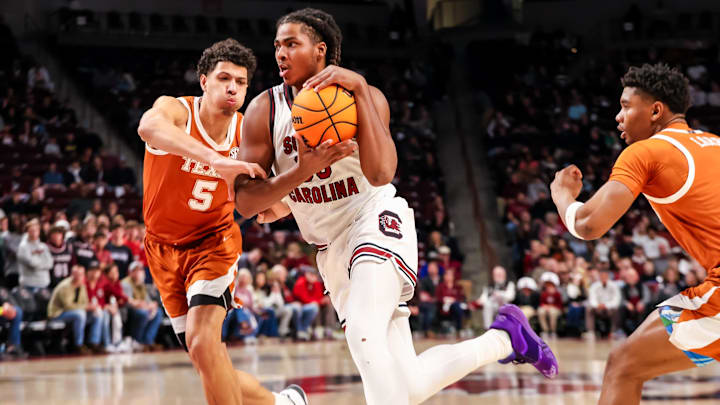 Feb 22, 2025; Columbia, South Carolina, USA; South Carolina Gamecocks forward Collin Murray-Boyles (30) drives past Texas Longhorns forward Kadin Shedrick (5) in the first half at Colonial Life Arena. Mandatory Credit: Jeff Blake-Imagn Images