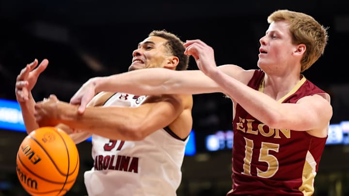 Dec 22, 2023; Columbia, S.C. ; South Carolina forward Ben Bosmans-Verdonk (31) and Elon guard Ned Hull (15) battle for a rebound.