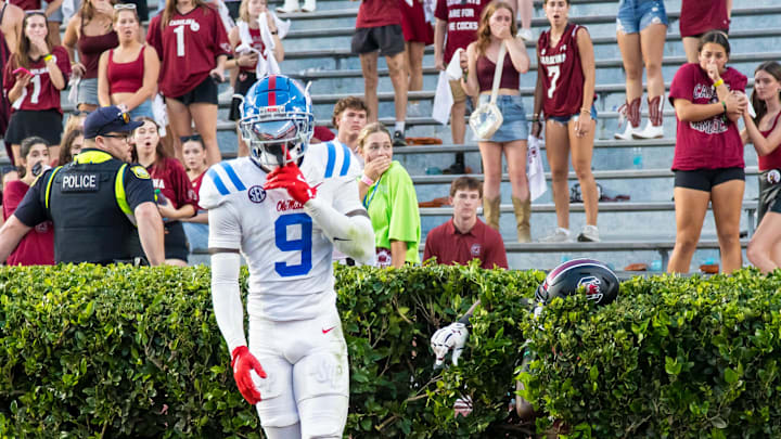 Oct 5, 2024; Columbia, South Carolina, USA; Mississippi Rebels wide receiver Tre Harris (9) celebrates knocking a pass away from South Carolina Gamecocks wide receiver Dalevon Campbell (15), in the hedge, in the second half at Williams-Brice Stadium. Mandatory Credit: Jeff Blake-Imagn Images Oct 5, 2024; Columbia, South Carolina, USA; Mississippi Rebels wide receiver Tre Harris (9) celebrates knocking a pass away from South Carolina Gamecocks wide receiver Dalevon Campbell (15), in the hedge, in the second half at Williams-Brice Stadium. Mandatory Credit: Jeff Blake-Imagn Images