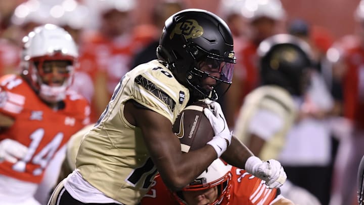 Oct 25, 2025; Salt Lake City, Utah, USA; Colorado Buffaloes wide receiver Kam Mikell (18) runs the ball against Utah Utes linebacker Trey Reynolds (37) during the third quarter at Rice-Eccles Stadium. Mandatory Credit: Rob Gray-Imagn Images Oct 25, 2025; Salt Lake City, Utah, USA; Colorado Buffaloes wide receiver Kam Mikell (18) runs the ball against Utah Utes linebacker Trey Reynolds (37) during the third quarter at Rice-Eccles Stadium. Mandatory Credit: Rob Gray-Imagn Images