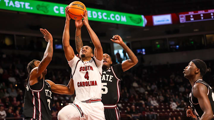 South Carolina Gamecocks guard Kobe Knox (4) drives past Mississippi State Bulldogs forward Jamarion Davis-Fleming (0) and guard Shawn Jones Jr. (5) in the first half at Colonial Life Arena.
