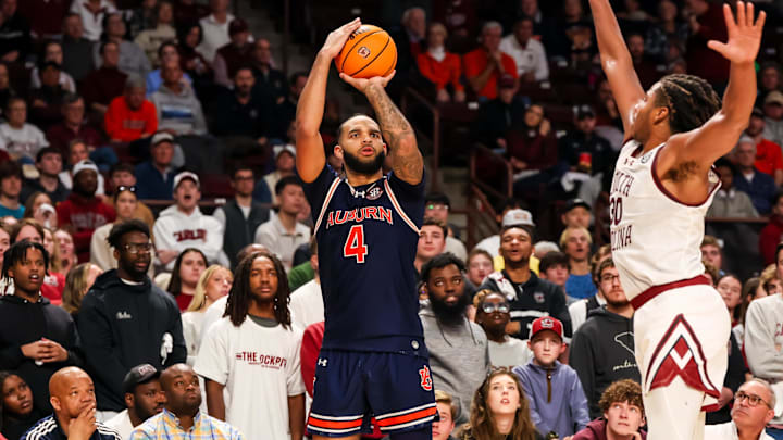 Jan 11, 2025; Columbia, South Carolina, USA; Auburn Tigers forward Johni Broome (4) attempts a three point basket over South Carolina Gamecocks forward Collin Murray-Boyles (30) in the second half at Colonial Life Arena. Mandatory Credit: Jeff Blake-Imagn Images
