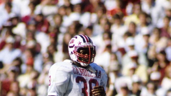 Nov 1, 1980; Athens, GA, USA; FILE PHOTO; South Carolina Gamecocks running back George Rogers (38) on the field against the Georgia Bulldogs at Sanford Stadium. Mandatory Credit: Manny Rubio-USA TODAY Sports
Nov 1, 1980; Athens, GA, USA; FILE PHOTO; South Carolina Gamecocks running back George Rogers (38) on the field against the Georgia Bulldogs at Sanford Stadium. Mandatory Credit: Manny Rubio-USA TODAY Sports