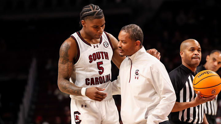 Dec 30, 2024; Columbia, South Carolina, USA; South Carolina Gamecocks head coach Lamont Paris speaks with forward Nick Pringle (5) against the Presbyterian Blue Hose in the second half at Colonial Life Arena. Mandatory Credit: Jeff Blake-Imagn Images Dec 30, 2024; Columbia, South Carolina, USA; South Carolina Gamecocks head coach Lamont Paris speaks with forward Nick Pringle (5) against the Presbyterian Blue Hose in the second half at Colonial Life Arena. Mandatory Credit: Jeff Blake-Imagn Images