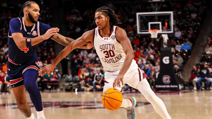 Jan 11, 2025; Columbia, South Carolina, USA; South Carolina Gamecocks forward Collin Murray-Boyles (30) controls the ball as Auburn Tigers forward Johni Broome (4) defends n the first half at Colonial Life Arena. Mandatory Credit: Jeff Blake-Imagn Images