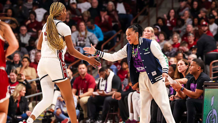 Jan 19, 2025; Columbia, South Carolina, USA; South Carolina Gamecocks head coach Dawn Staley high fives forward Maryam Dauda (30) in the first half at Colonial Life Arena. Mandatory Credit: Jeff Blake-Imagn Images