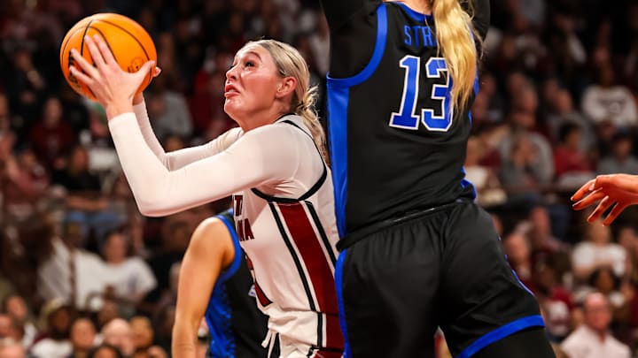 Mar 2, 2025; Columbia, South Carolina, USA; South Carolina Gamecocks forward Chloe Kitts (21) looks to shoot over Kentucky Wildcats center Clara Strack (13) in the first half at Colonial Life Arena. Mandatory Credit: Jeff Blake-Imagn Images Mar 2, 2025; Columbia, South Carolina, USA; South Carolina Gamecocks forward Chloe Kitts (21) looks to shoot over Kentucky Wildcats center Clara Strack (13) in the first half at Colonial Life Arena. Mandatory Credit: Jeff Blake-Imagn Images