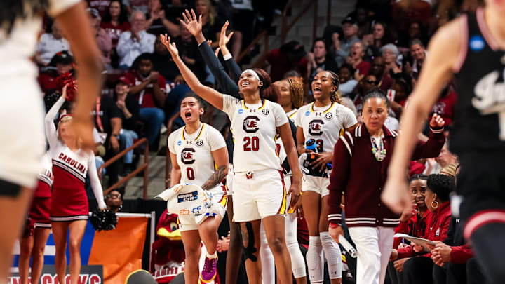 Mar 23, 2025; Columbia, South Carolina, USA; South Carolina Gamecocks guard Te-Hina Paopao (0), forward Sania Feagin (20) and guard Bree Hall (23) celebrate a play against the Indiana Hoosiers in the second half at Colonial Life Arena. Mandatory Credit: Jeff Blake-Imagn Images