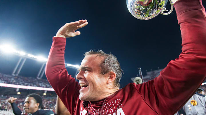 Nov 16, 2024; Columbia, South Carolina, USA; South Carolina Gamecocks head coach Shane Beamer celebrates beating the Missouri Tigers at Williams-Brice Stadium. He is holding the Mayors Cup, given to the winner of the South Carolina-Missouri game. Mandatory Credit: Jeff Blake-Imagn Images Nov 16, 2024; Columbia, South Carolina, USA; South Carolina Gamecocks head coach Shane Beamer celebrates beating the Missouri Tigers at Williams-Brice Stadium. He is holding the Mayors Cup, given to the winner of the South Carolina-Missouri game. Mandatory Credit: Jeff Blake-Imagn Images