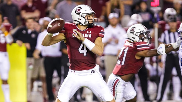 Sep 25, 2021; Columbia, South Carolina, USA; South Carolina Gamecocks quarterback Luke Doty (4) throws a pass against the Kentucky Wildcats in the fourth quarter at Williams-Brice Stadium. Mandatory Credit: Jeff Blake-Imagn Images