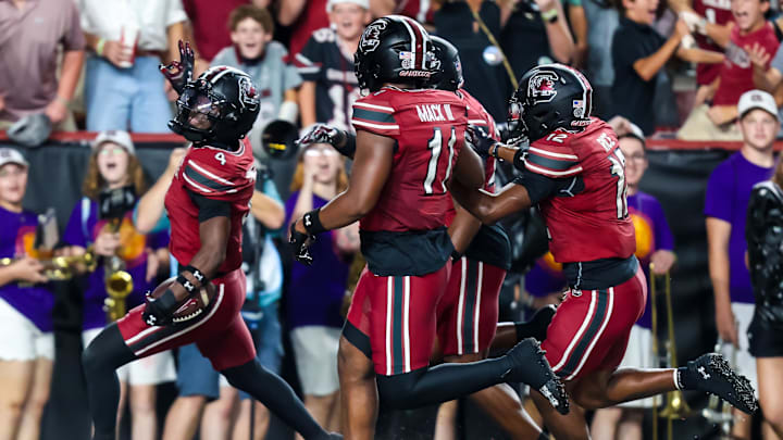 Sep 6, 2025; Columbia, South Carolina, USA; South Carolina Gamecocks defensive back Vicari Swain (4) celebrates his second punt return touchdown against the South Carolina State Bulldogs in the second quarter at Williams-Brice Stadium. Mandatory Credit: Jeff Blake-Imagn Images Sep 6, 2025; Columbia, South Carolina, USA; South Carolina Gamecocks defensive back Vicari Swain (4) celebrates his second punt return touchdown against the South Carolina State Bulldogs in the second quarter at Williams-Brice Stadium. Mandatory Credit: Jeff Blake-Imagn Images