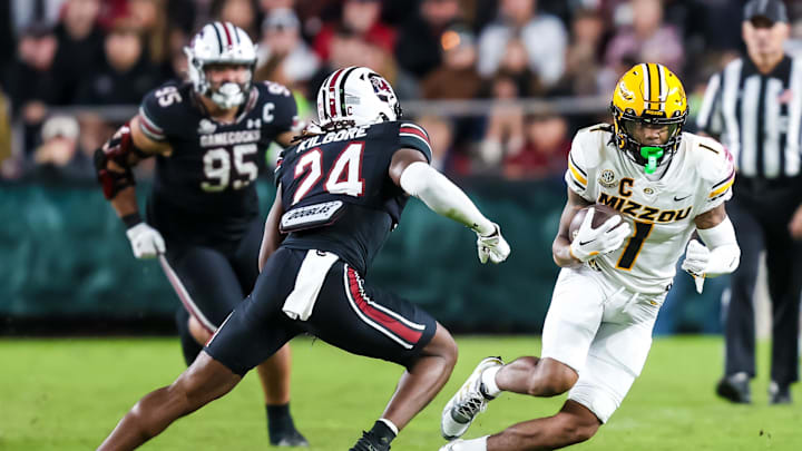 Nov 16, 2024; Columbia, South Carolina, USA; Missouri Tigers wide receiver Theo Wease Jr. (1) runs after a reception against South Carolina Gamecocks defensive back Jalon Kilgore (24) in the second half at Williams-Brice Stadium. Mandatory Credit: Jeff Blake-Imagn Images