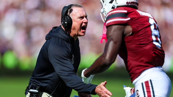 Oct 18, 2025; Columbia, South Carolina, USA; South Carolina Gamecocks interim offensive line coach Shawn Elliott directs his players against the Oklahoma Sooners in the second quarter at Williams-Brice Stadium. Mandatory Credit: Jeff Blake-Imagn Images