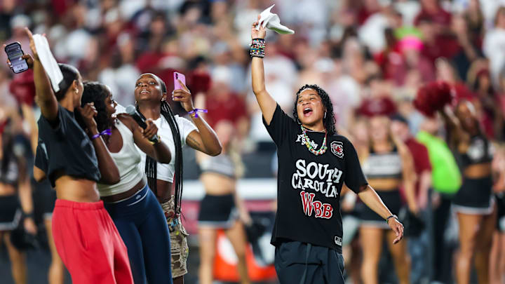 Sep 6, 2025; Columbia, South Carolina, USA; South Carolina Gamecocks head women’s basketball coach Dawn Staley leads the crowd in a cheer before the game against the South Carolina State Bulldogs at Williams-Brice Stadium. Mandatory Credit: Jeff Blake-Imagn Images