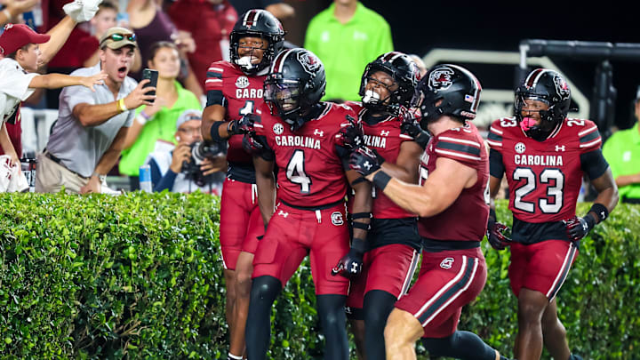 Sep 6, 2025; Columbia, South Carolina, USA; South Carolina Gamecocks defensive back Vicari Swain (4) celebrates his second punt return touchdown against the South Carolina State Bulldogs in the second quarter at Williams-Brice Stadium. Mandatory Credit: Jeff Blake-Imagn Images Sep 6, 2025; Columbia, South Carolina, USA; South Carolina Gamecocks defensive back Vicari Swain (4) celebrates his second punt return touchdown against the South Carolina State Bulldogs in the second quarter at Williams-Brice Stadium. Mandatory Credit: Jeff Blake-Imagn Images