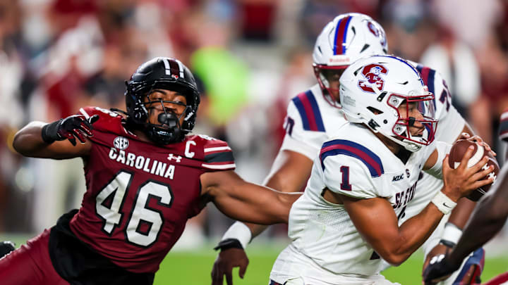 Sep 6, 2025; Columbia, South Carolina, USA; South Carolina State Bulldogs quarterback William Atkins IV (1) escapes the pressure of South Carolina Gamecocks linebacker Bryan Thomas Jr. (46) in the second quarter at Williams-Brice Stadium. Mandatory Credit: Jeff Blake-Imagn Images