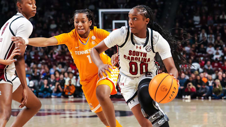 Feb 8, 2026; Columbia, South Carolina, USA; South Carolina Gamecocks guard Ta'niya Latson (00) drives around Tennessee Volunteers guard Nya Robertson (1) in the first half at Colonial Life Arena. Mandatory Credit: Jeff Blake-Imagn Images