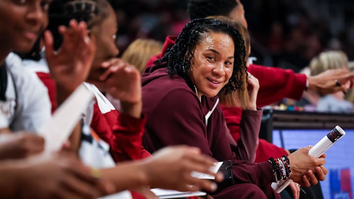 Feb 22, 2026; Columbia, South Carolina, USA; South Carolina Gamecocks head coach Dawn Staley smiles at her bench players against the Mississippi Rebels in the second half at Colonial Life Arena. Mandatory Credit: Jeff Blake-Imagn Images