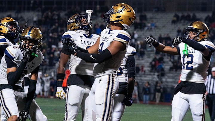 La Salle's JP Oates, 2, celebrates his touchdown against Easton with teammates, Joey O'Brien, 6, Josh Simmons, 8, and Chima Auguste, 12, during the PIAA football quarterfinals in Bethlehem on Nov. 21, 2025.