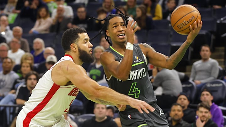 Nov 26, 2024; Minneapolis, Minnesota, USA; Houston Rockets guard Fred VanVleet (5) defends against Minnesota Timberwolves guard Rob Dillingham (4) in overtime at Target Center. Mandatory Credit: Bruce Kluckhohn-Imagn Images