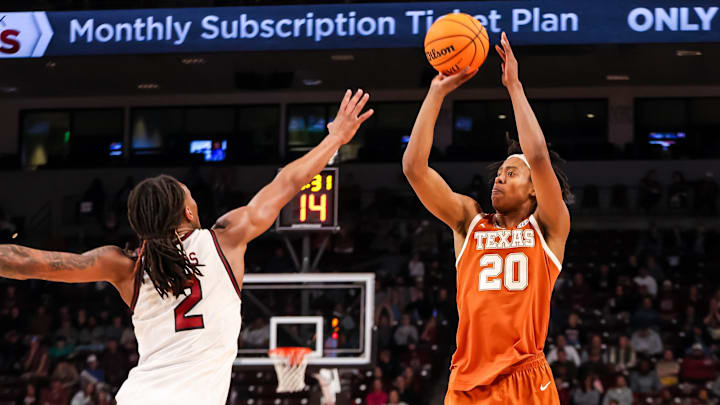 Feb 22, 2025; Columbia, South Carolina, USA; Texas Longhorns guard Tre Johnson (20) shoots over South Carolina Gamecocks guard Zachary Davis (2) in the second half at Colonial Life Arena. Mandatory Credit: Jeff Blake-Imagn Images