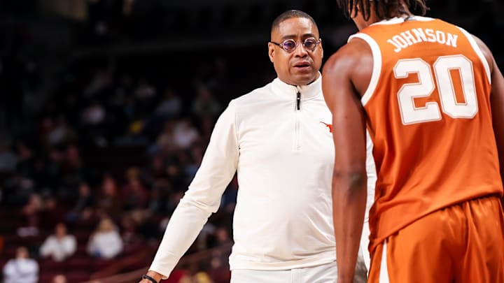 Feb 22, 2025; Columbia, South Carolina, USA; Texas Longhorns head coach Rodney Terry speaks with guard Tre Johnson (20) against the South Carolina Gamecocks in the first half at Colonial Life Arena. Mandatory Credit: Jeff Blake-Imagn Images