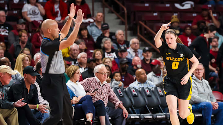 Feb 8, 2024; Columbia, South Carolina, USA; Missouri Tigers guard Grace Slaughter (0) celebrates a three point basket against the Missouri Tigers in the first half at Colonial Life Arena. Mandatory Credit: Jeff Blake-Imagn Images