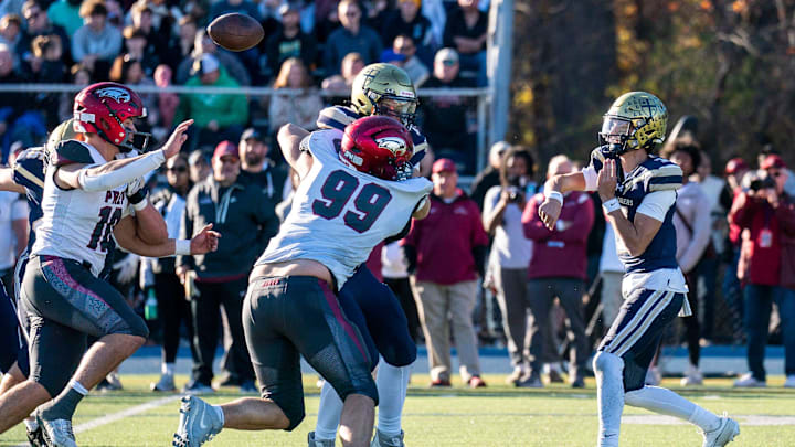 La Salle's Gavin Sidwar throws a pass over St. Joseph's Prep's defensive linemen during the Philadelphia Catholic League 6A football championship game in Ambler on Saturday, Nov. 9, 2024.
