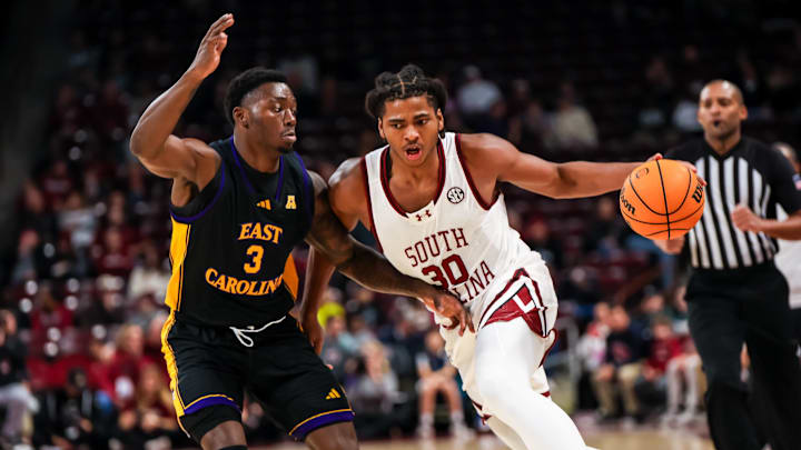 Dec 7, 2024; Columbia, South Carolina, USA; South Carolina Gamecocks forward Collin Murray-Boyles (30) drives around East Carolina Pirates guard RJ Felton (3) in the first half at Colonial Life Arena. Mandatory Credit: Jeff Blake-Imagn Images Dec 7, 2024; Columbia, South Carolina, USA; South Carolina Gamecocks forward Collin Murray-Boyles (30) drives around East Carolina Pirates guard RJ Felton (3) in the first half at Colonial Life Arena. Mandatory Credit: Jeff Blake-Imagn Images
