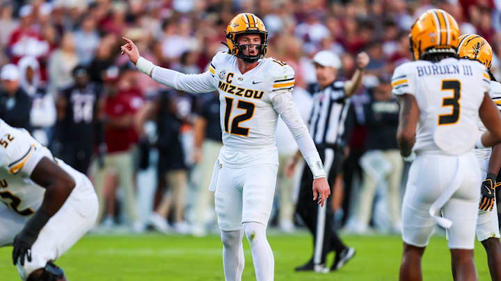 Nov 16, 2024; Columbia, South Carolina, USA; Missouri Tigers quarterback Brady Cook (12) directs his offense against the South Carolina Gamecocks in the first quarter at Williams-Brice Stadium. Mandatory Credit: Jeff Blake-Imagn Images