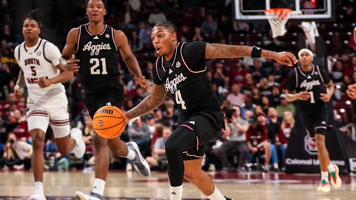 Feb 1, 2025; Columbia, South Carolina, USA; Texas A&M Aggies guard Wade Taylor IV (4) brings the ball up against the South Carolina Gamecocks in the second half at Colonial Life Arena. Mandatory Credit: Jeff Blake-Imagn Images