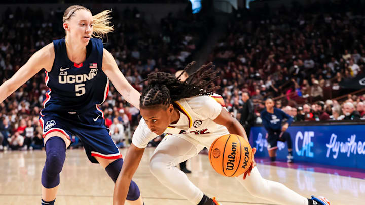 Gamecocks forward Chloe Kitts drives around Huskies guard Paige Bueckers. 