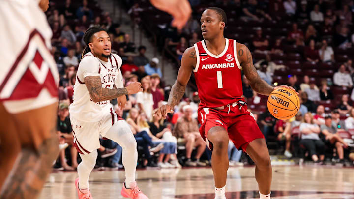 Mar 1, 2025; Columbia, South Carolina, USA; Arkansas Razorbacks guard Johnell Davis (1) drives against the South Carolina Gamecocks in the second half at Colonial Life Arena. Mandatory Credit: Jeff Blake-Imagn Images