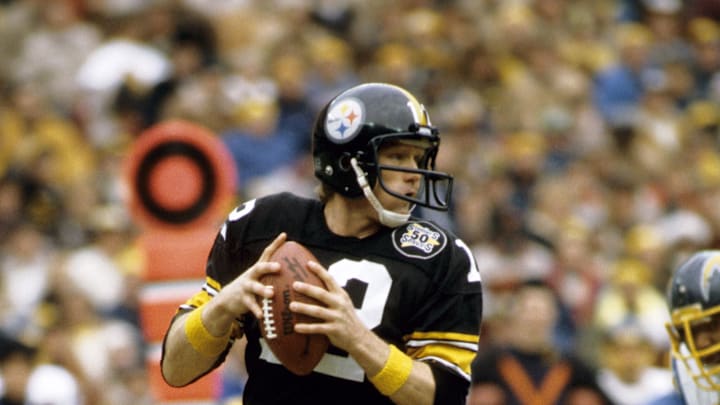 Jan 9, 1983; Pittsburgh, PA, USA; FILE PHOTO; Pittsburgh Steelers quarterback Terry Bradshaw (12) in action against the San Diego Chargers during the 1982 Wild Card Playoff game at Three Rivers Stadium. The Chargers defeated the Steelers 31-28. Mandatory Credit: Malcolm Emmons-Imagn Images Jan 9, 1983; Pittsburgh, PA, USA; FILE PHOTO; Pittsburgh Steelers quarterback Terry Bradshaw (12) in action against the San Diego Chargers during the 1982 Wild Card Playoff game at Three Rivers Stadium. The Chargers defeated the Steelers 31-28. Mandatory Credit: Malcolm Emmons-Imagn Images