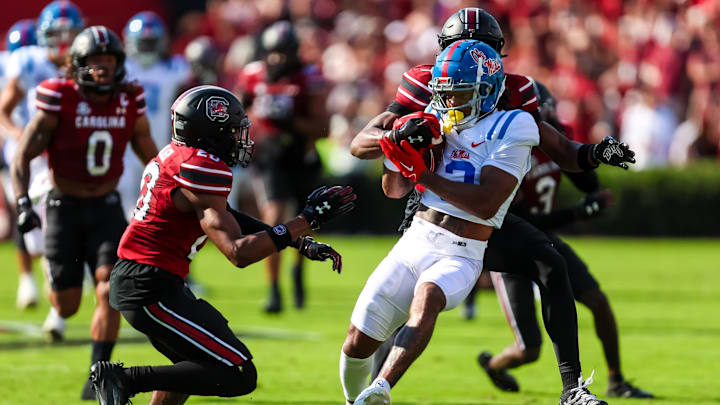 Oct 5, 2024; Columbia, South Carolina, USA; Mississippi Rebels wide receiver Antwane Wells Jr. (3) attempts to get past South Carolina Gamecocks defensive back Judge Collier (20) and defensive back Nick Emmanwori (7) in the first quarter at Williams-Brice Stadium. Mandatory Credit: Jeff Blake-Imagn Images