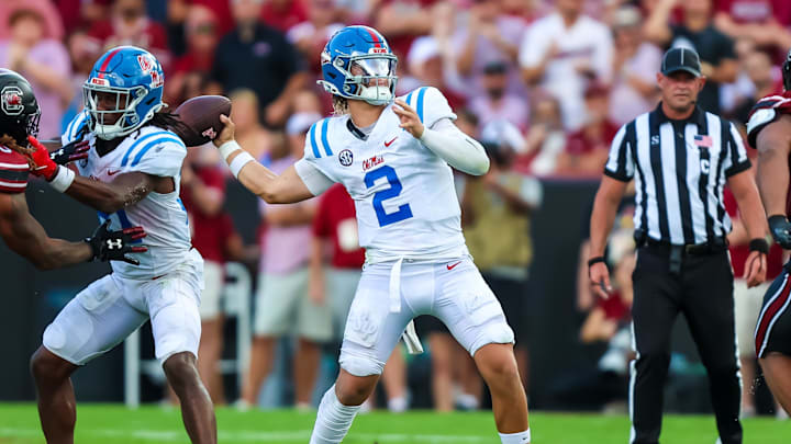 Oct 5, 2024; Columbia, South Carolina, USA; Mississippi Rebels quarterback Jaxson Dart (2) passes against the South Carolina Gamecocks in the second quarter at Williams-Brice Stadium. Mandatory Credit: Jeff Blake-Imagn Images