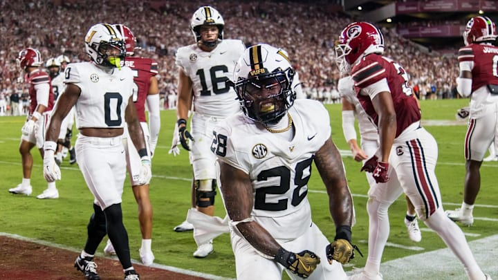 Sep 13, 2025; Columbia, South Carolina, USA; Vanderbilt Commodores running back Sedrick Alexander (28) celebrates a touchdown against the South Carolina Gamecocks in the first quarter at Williams-Brice Stadium. Mandatory Credit: Jeff Blake-Imagn Images