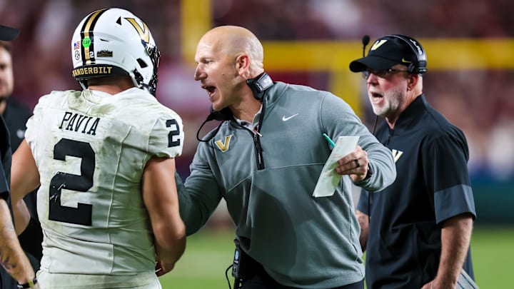 Sep 13, 2025; Columbia, South Carolina, USA; Vanderbilt Commodores head coach Clark Lea speaks with quarterback Diego Pavia (2) against the South Carolina Gamecocks in the second half at Williams-Brice Stadium. Mandatory Credit: Jeff Blake-Imagn Images
