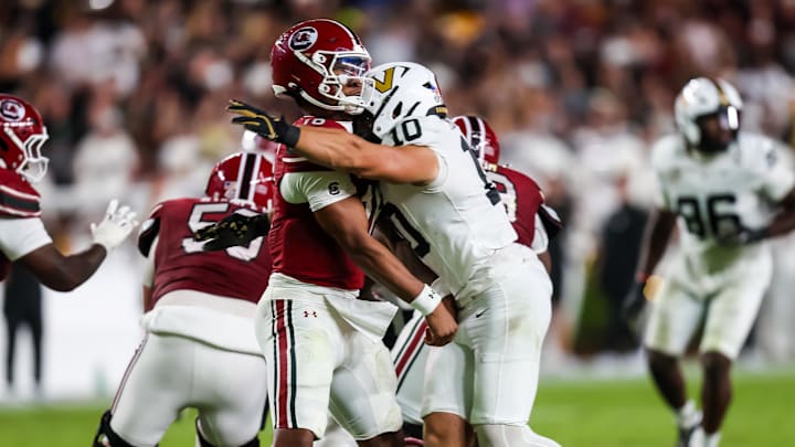 Sep 13, 2025; Columbia, South Carolina, USA; South Carolina Gamecocks quarterback LaNorris Sellers (16) is hit by Vanderbilt Commodores linebacker Langston Patterson (10) as he passes. Sellers was injured on the play and Patterson was ejected for targeting in the second quarter at Williams-Brice Stadium. Mandatory Credit: Jeff Blake-Imagn Images Sep 13, 2025; Columbia, South Carolina, USA; South Carolina Gamecocks quarterback LaNorris Sellers (16) is hit by Vanderbilt Commodores linebacker Langston Patterson (10) as he passes. Sellers was injured on the play and Patterson was ejected for targeting in the second quarter at Williams-Brice Stadium. Mandatory Credit: Jeff Blake-Imagn Images