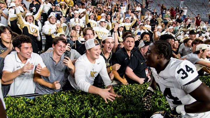 Sep 13, 2025; Columbia, South Carolina, USA; Vanderbilt Commodores linebacker Austin Howard (34) celebrates with fans following their win over the South Carolina Gamecocks at Williams-Brice Stadium. Mandatory Credit: Jeff Blake-Imagn Images