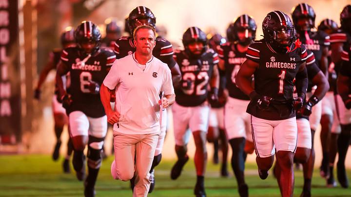 Sep 27, 2025; Columbia, South Carolina, USA; South Carolina Gamecocks head coach Shane Beamer leads his team onto the field during the Gamecocks 2001 entrance before their game against the Kentucky Wildcats at Williams-Brice Stadium. Mandatory Credit: Jeff Blake-Imagn Images