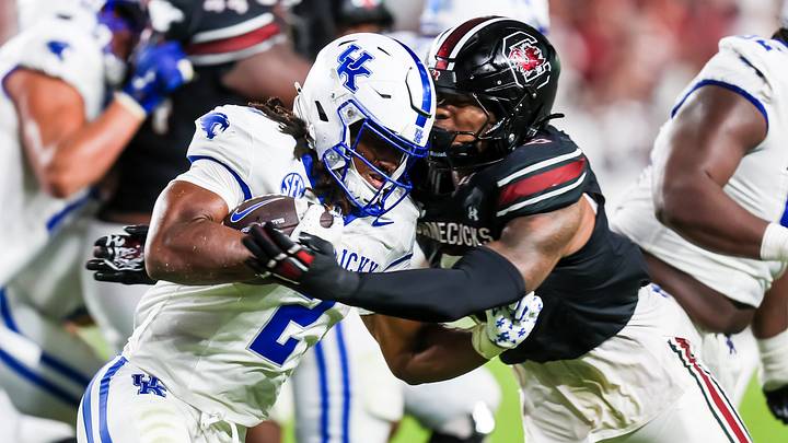Sep 27, 2025; Columbia, South Carolina, USA; Kentucky Wildcats running back Dante Dowdell (2) is stopped by South Carolina Gamecocks linebacker Dylan Stewart (6) in the second quarter at Williams-Brice Stadium. Mandatory Credit: Jeff Blake-Imagn Images Sep 27, 2025; Columbia, South Carolina, USA; Kentucky Wildcats running back Dante Dowdell (2) is stopped by South Carolina Gamecocks linebacker Dylan Stewart (6) in the second quarter at Williams-Brice Stadium. Mandatory Credit: Jeff Blake-Imagn Images