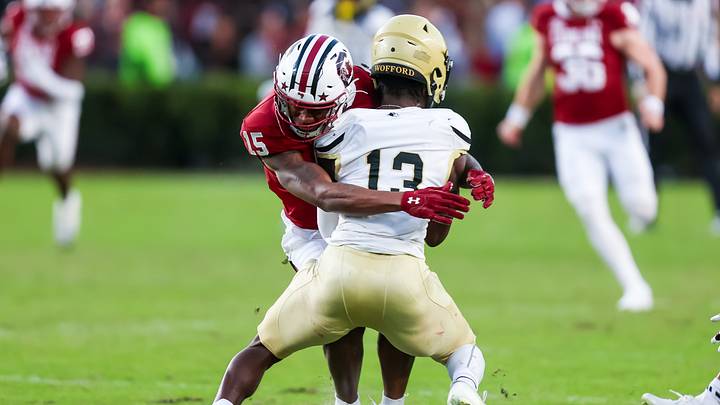 Nov 23, 2024; Columbia, South Carolina, USA; South Carolina Gamecocks linebacker Fred Johnson (15) tackles Wofford Terriers punt returner Cam Smith (13) in the second quarter at Williams-Brice Stadium. Mandatory Credit: Jeff Blake-Imagn Images Nov 23, 2024; Columbia, South Carolina, USA; South Carolina Gamecocks linebacker Fred Johnson (15) tackles Wofford Terriers punt returner Cam Smith (13) in the second quarter at Williams-Brice Stadium. Mandatory Credit: Jeff Blake-Imagn Images