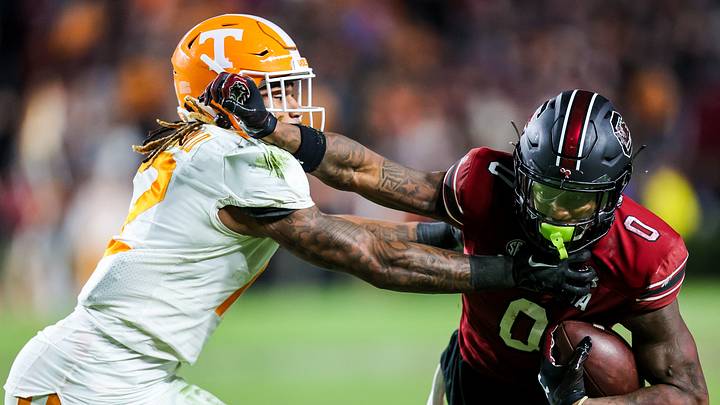 Nov 19, 2022; Columbia, South Carolina, USA; South Carolina Gamecocks tight end Jaheim Bell (0) stiff-arms Tennessee Volunteers defensive back Tamarion McDonald (12) in the second half at Williams-Brice Stadium. Mandatory Credit: Jeff Blake-USA TODAY Sports Nov 19, 2022; Columbia, South Carolina, USA; South Carolina Gamecocks tight end Jaheim Bell (0) stiff-arms Tennessee Volunteers defensive back Tamarion McDonald (12) in the second half at Williams-Brice Stadium. Mandatory Credit: Jeff Blake-USA TODAY Sports