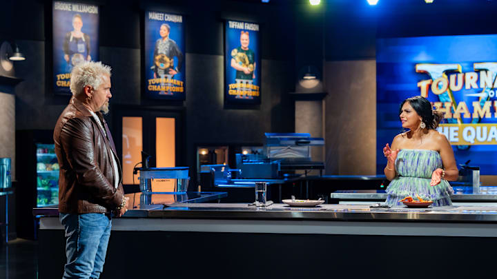 Host Guy Fieri with Judge Maneet Chauhan sampling Contestant Brittanny Anderson's dish during the judging of The Qualifiers, as seen on TOC Season 6